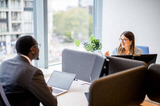 Colleagues discussing work