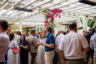 MEOGROUP employees networking at a professional event